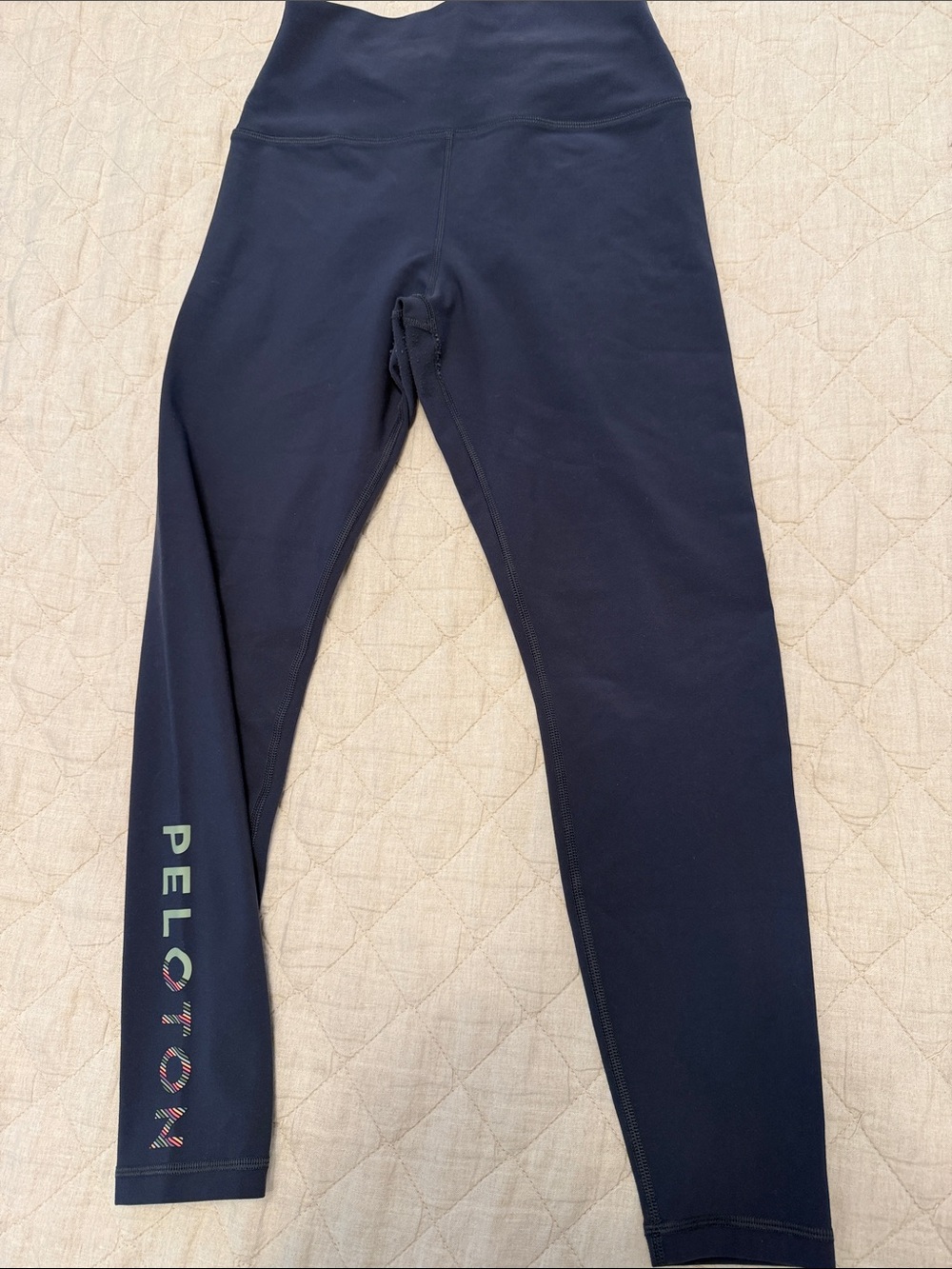 Peloton Navy Leggings with Multicolor Logo on Lower Leg